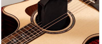 D'Addario's Humidipak product page showing the two-way humidity control packet resting inside an acoustic guitar's soundhole