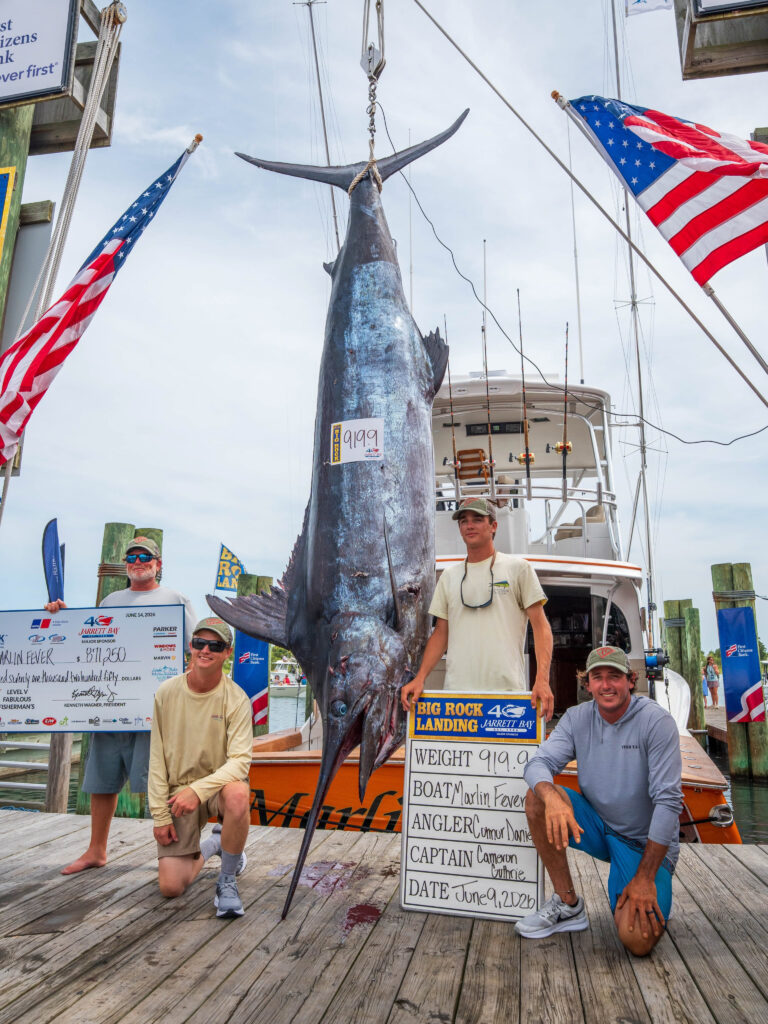 Marlin Fever's 919.9-pound blue marlin hanging at Big Rock Landing in Morehead City, NC, June 9, 2026 &mdash; the new all-time tournament record