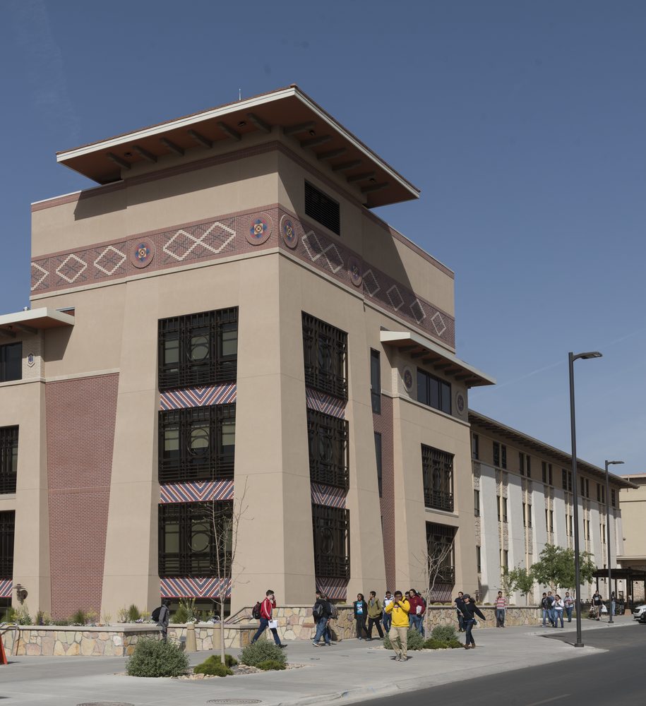 A University of Texas at El Paso campus building built in the Bhutanese Dzong architectural style, with sloping walls, an overhanging roof, and colorful painted decorative bands