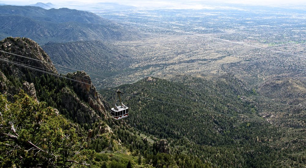 A Sandia Peak Tramway cable car climbing above the desert landscape near Albuquerque, New Mexico