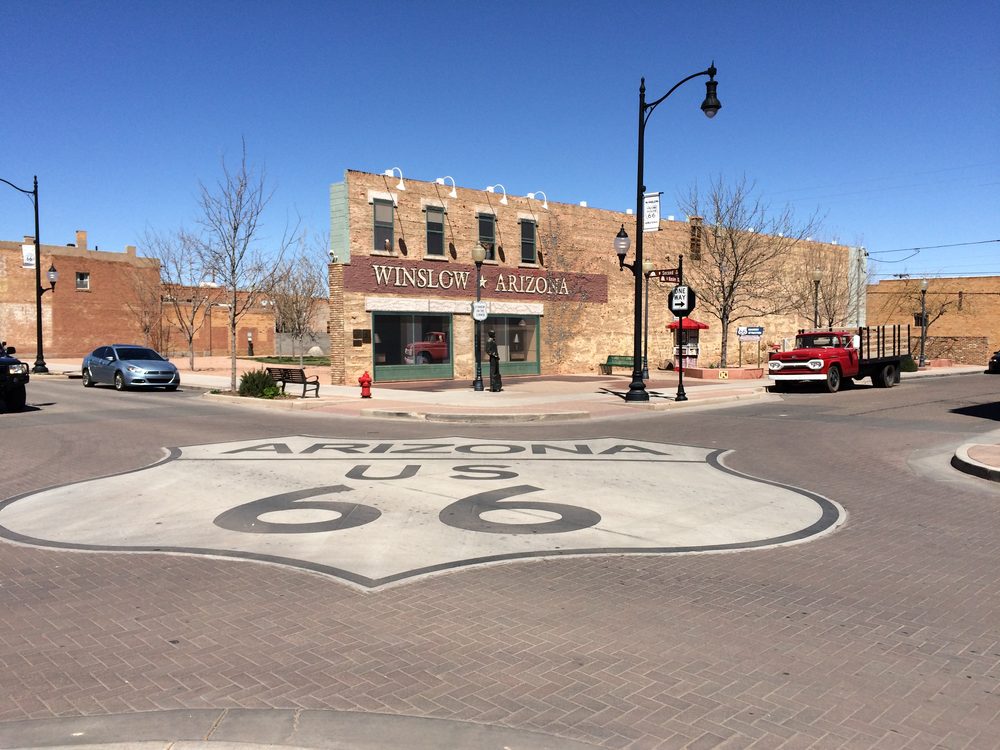 Standin' on the Corner Park in downtown Winslow, Arizona, with its bronze statue, mural, and flatbed Ford truck