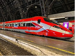 Wikipedia's Frecciarossa article showing a photo of the red high-speed train pulling into a station platform