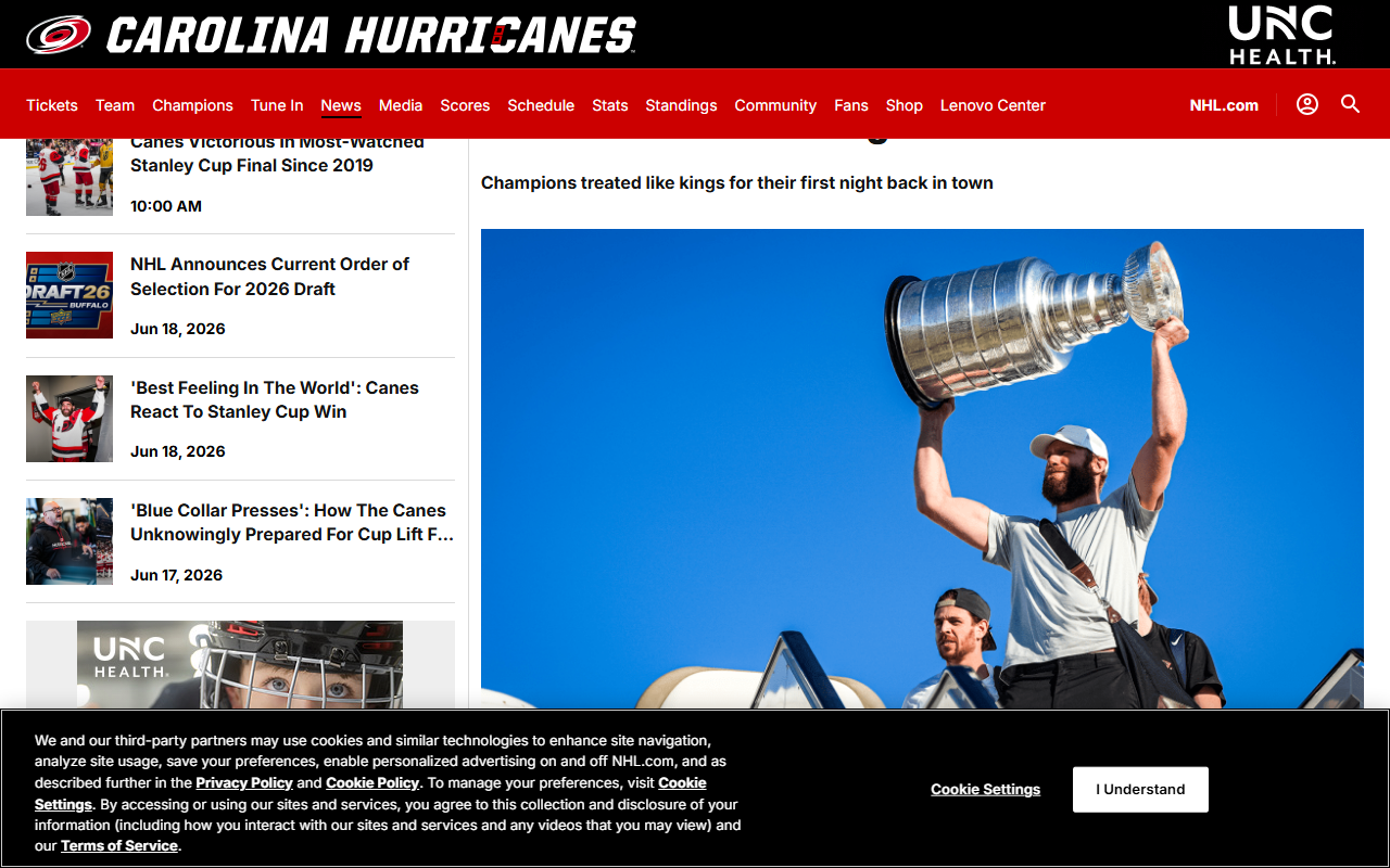 Jordan Staal hoists the Stanley Cup above his head as the Carolina Hurricanes return to Raleigh, June 16, 2026 — screenshot via nhl.com/hurricanes.