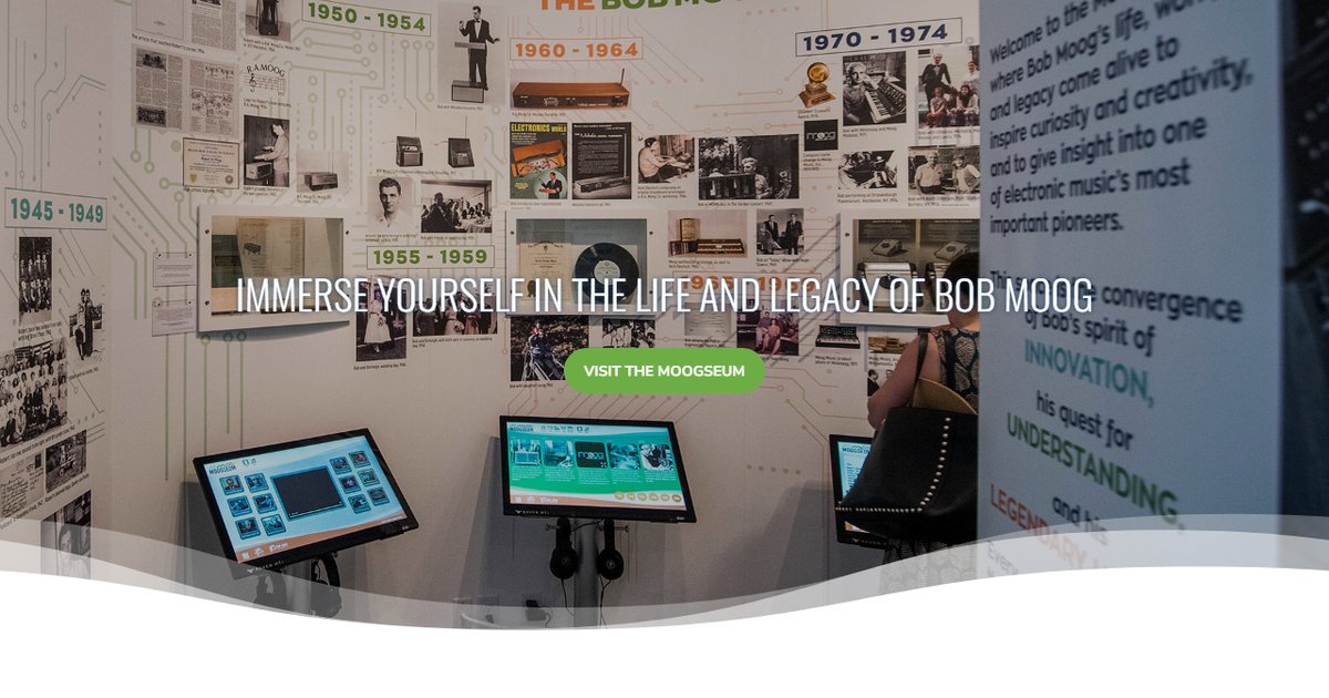The Moogseum interactive exhibit space showing Bob Moog timeline and hands-on synthesizer displays