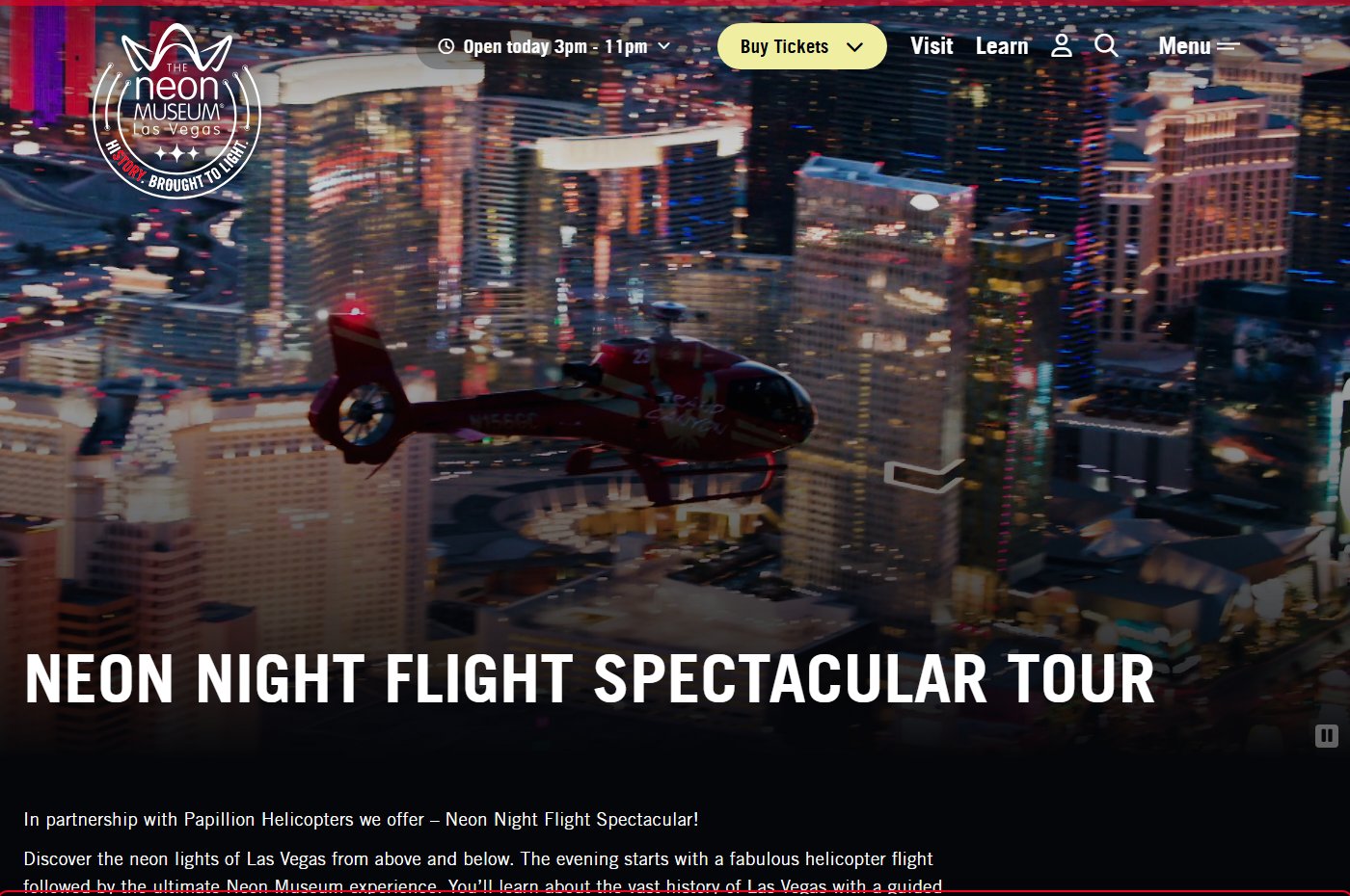 The Neon Museum's own webpage for the Neon Night Flight Spectacular Tour, showing a Papillon Helicopters helicopter flying over the illuminated Las Vegas Strip at night