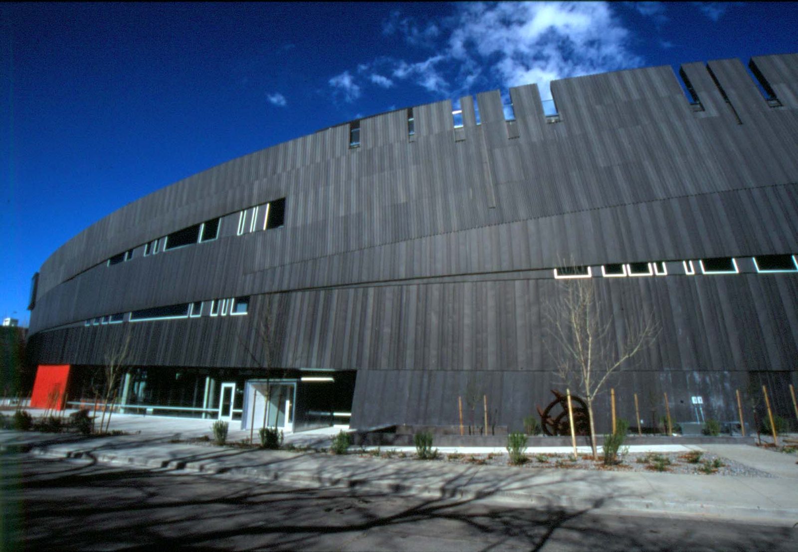 The exterior of the Nevada Museum of Art in Reno, a modern building with dark, angular geometric facades designed by architect Will Bruder