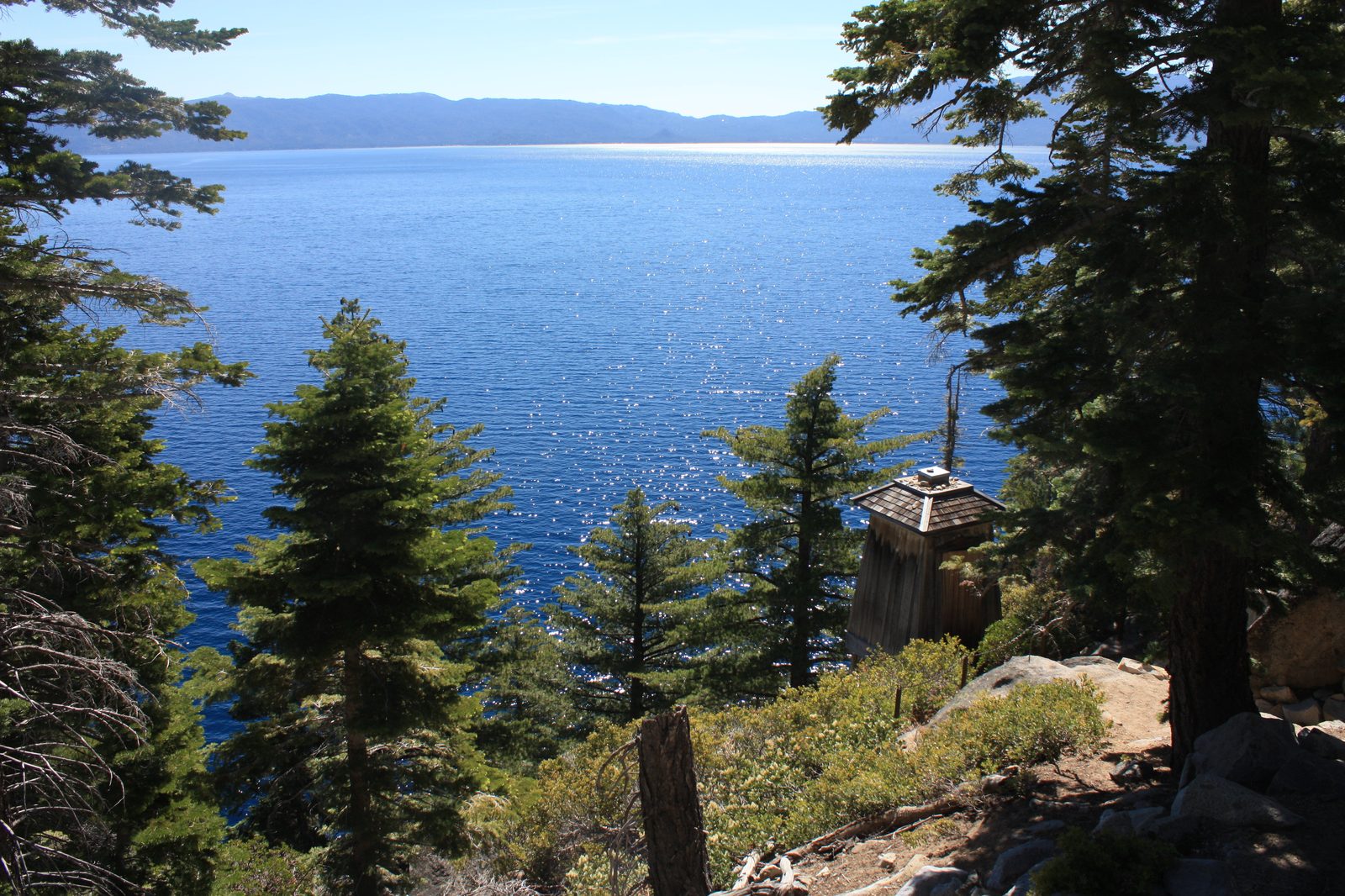 Rubicon Point Light, a small white lighthouse structure on a rocky point overlooking Lake Tahoe at D.L. Bliss State Park