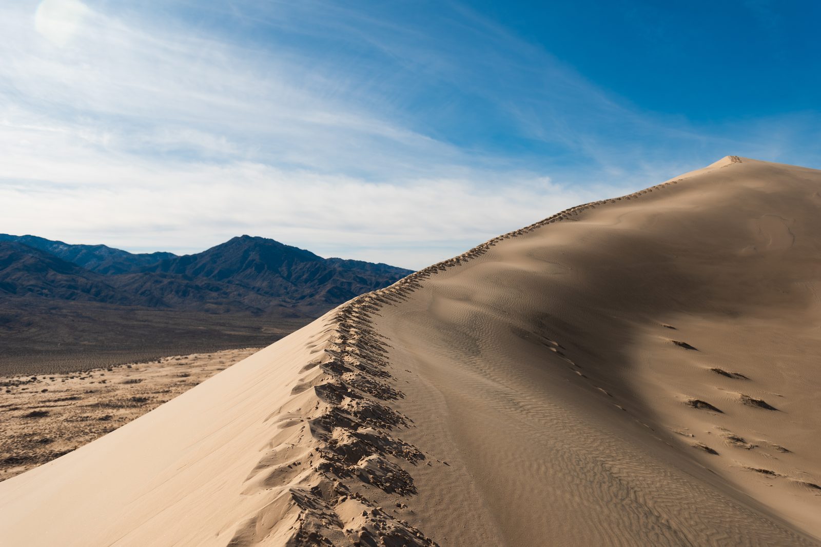 Kelso Dunes rising above the desert floor in Mojave National Preserve, California