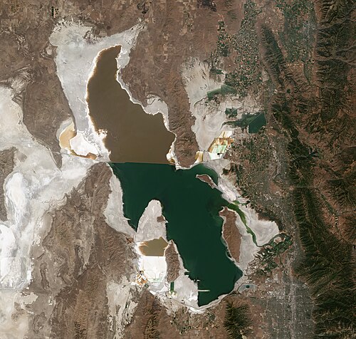 A Sentinel-2 satellite view of the Great Salt Lake, showing the color divide created by the railroad causeway splitting its northern and southern arms