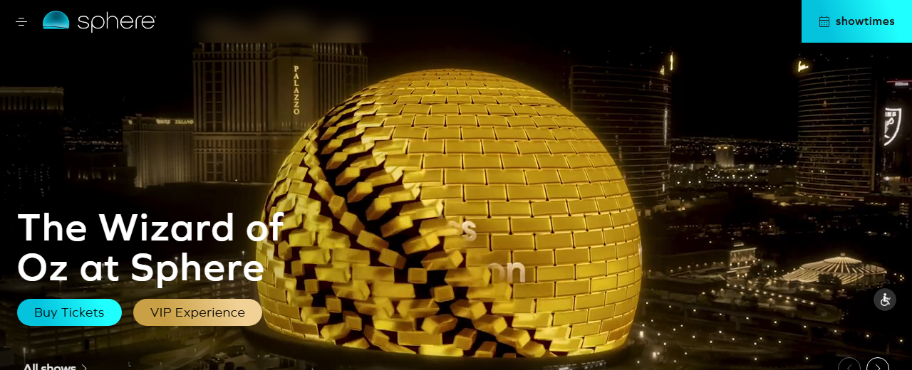 Sphere's official homepage showing its illuminated golden geodesic exterior at night beside the Wizard of Oz at Sphere marquee, with Eagles, Backstreet Boys, and Formula 1 afterparty show tiles below