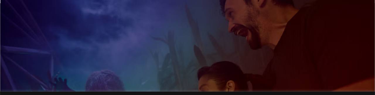 AREA15's official page for Universal Horror Unleashed, showing a photo of guests reacting to actors in a fog-lit haunted cornfield scene