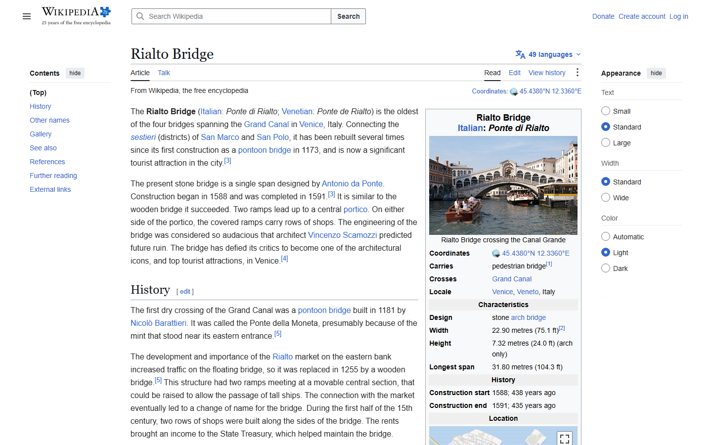 Wikipedia's Rialto Bridge article showing a photo of the stone bridge's single arched span crossing the Grand Canal, with gondolas passing beneath it