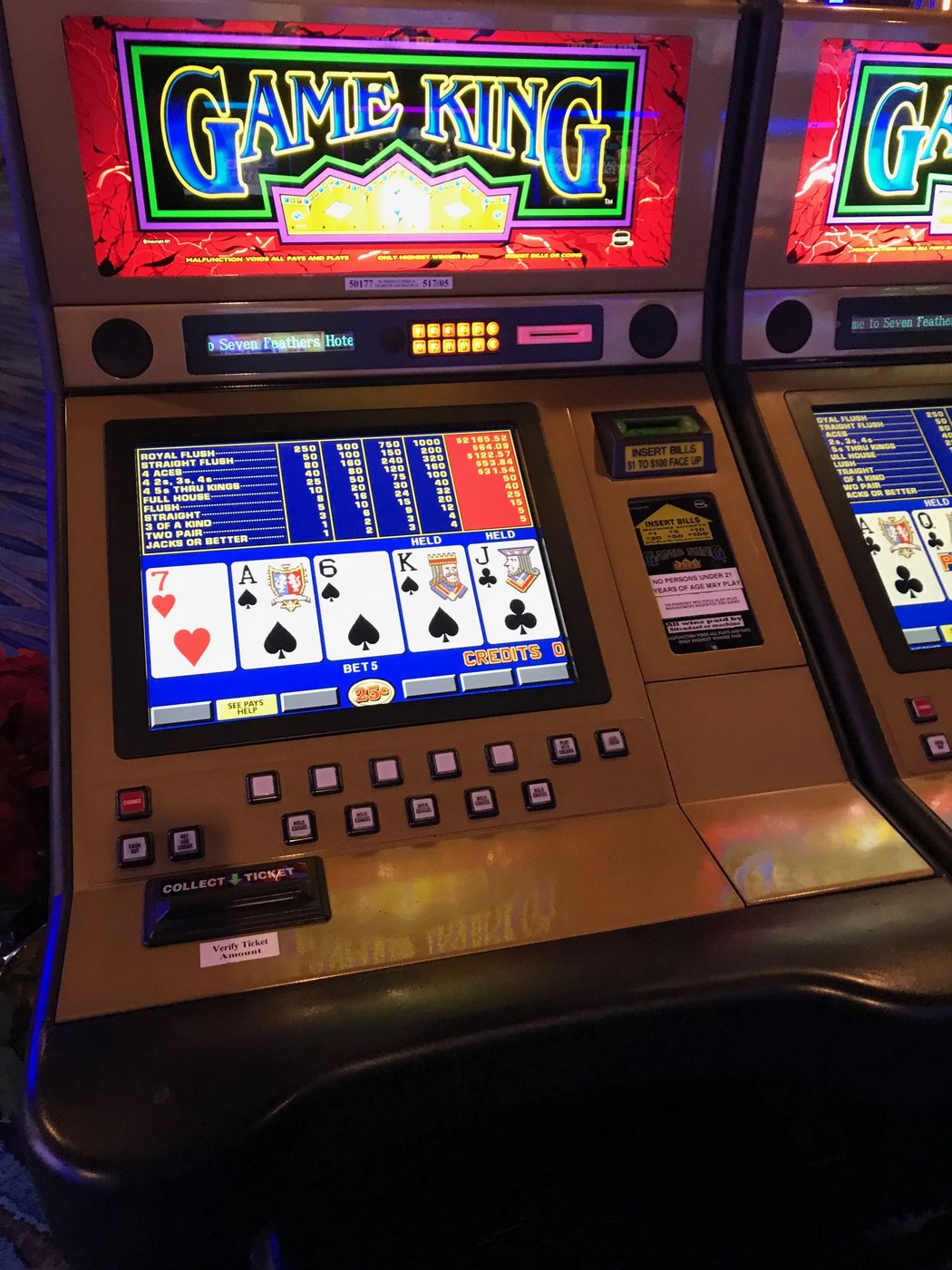 A real close-up photo of a video poker machine's game screen
